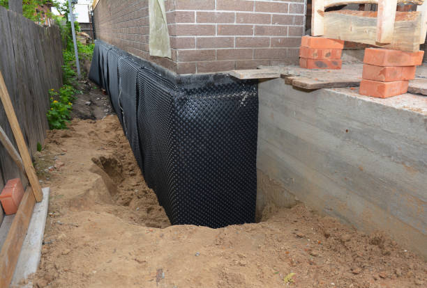 Happy homeowners after waterproofing job in Ney